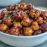 Spicy roasted chickpeas with bold chili-garlic flavor, paired with fluffy jasmine rice for a satisfying plant-based meal.  