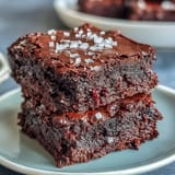 Decadent sourdough discard brownies topped with sea salt flakes, offering a rich, fudgy texture and perfect sweet-salty balance.
