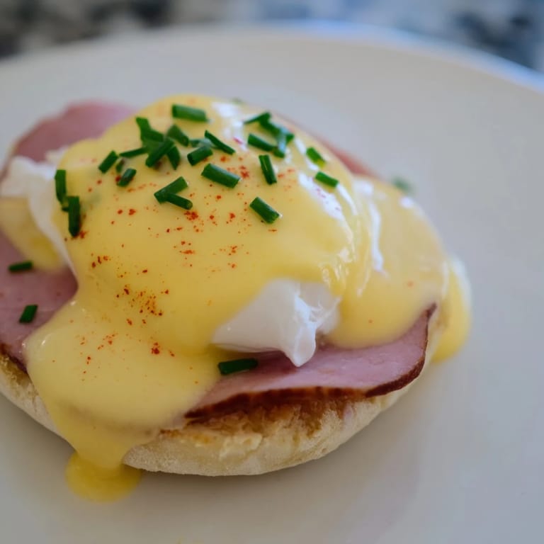 Toasted English muffins supporting Canadian bacon and perfectly poached eggs become the delicious Eggs Benedict.