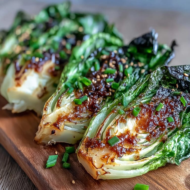 Roasted Miso Butter Roasted Cabbage Wedges beside rice bowls for a vegetarian dinner plate